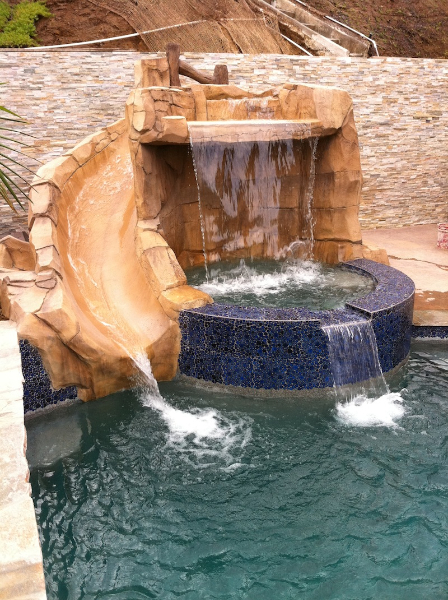 spa with grotto and slide formation